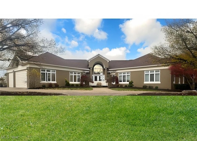 ranch-style house with a garage and a front lawn