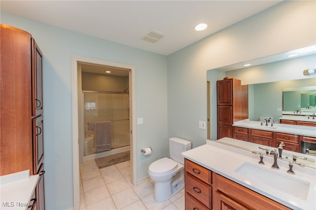 bathroom featuring tile patterned flooring, vanity, and toilet