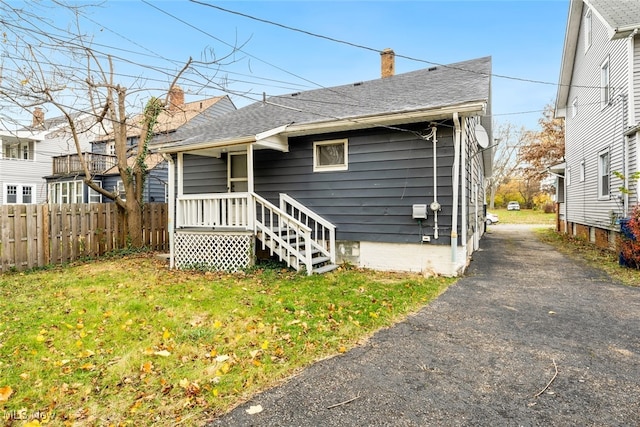 rear view of house with a lawn