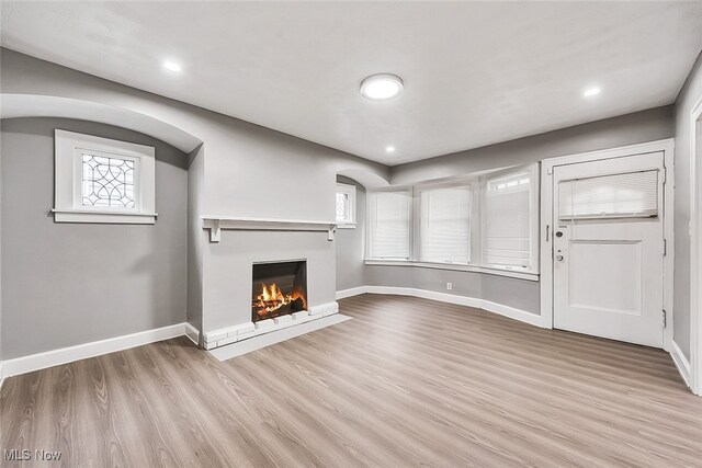 unfurnished living room with light hardwood / wood-style floors