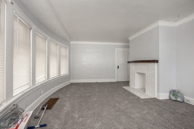 unfurnished living room featuring carpet floors, ornamental molding, and a brick fireplace