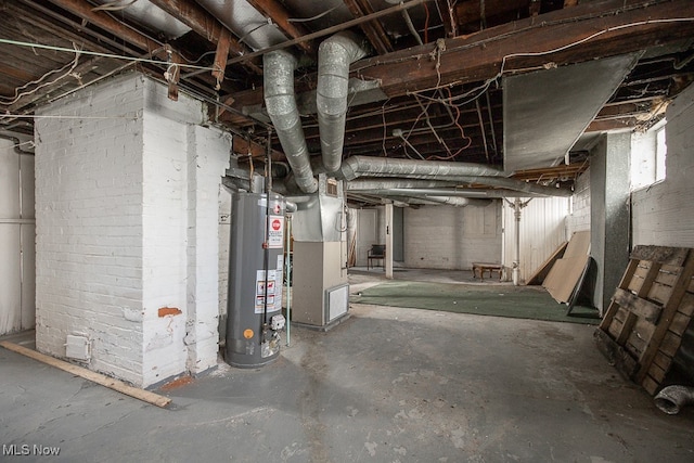 basement featuring heating unit and water heater