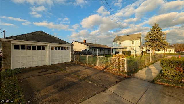 exterior space with an outbuilding and a garage