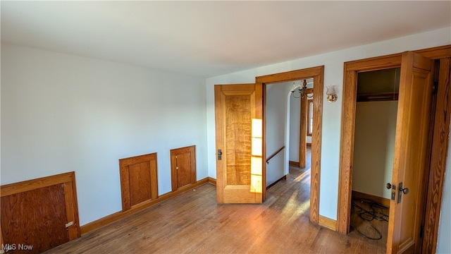 unfurnished room featuring wood-type flooring