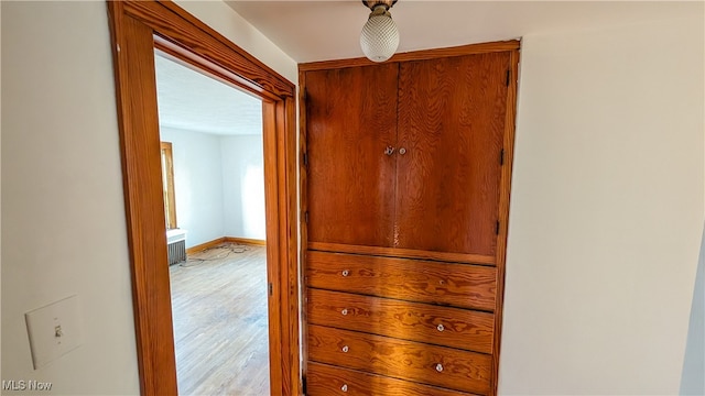 corridor featuring light hardwood / wood-style flooring