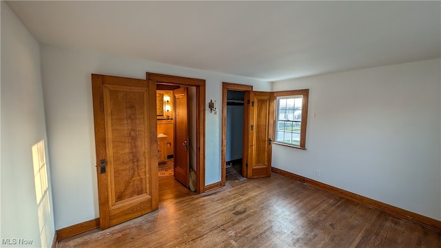 unfurnished bedroom featuring wood-type flooring