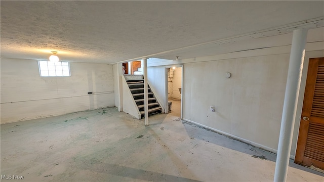 basement with a textured ceiling