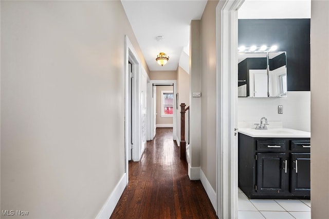 hall with wood-type flooring and sink