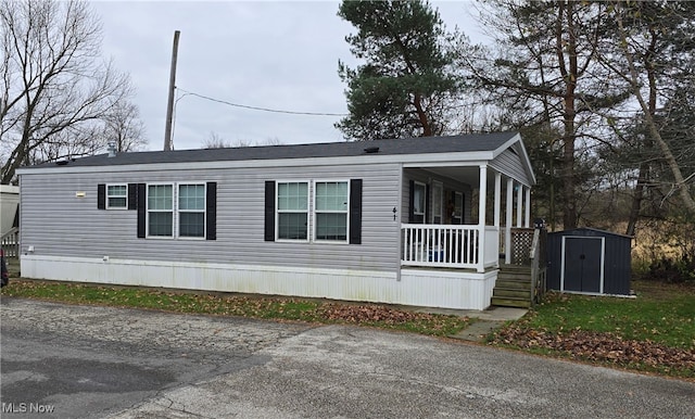 exterior space with a porch and a storage unit