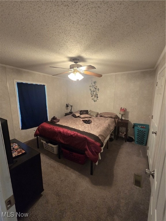 carpeted bedroom featuring ceiling fan, a textured ceiling, and ornamental molding