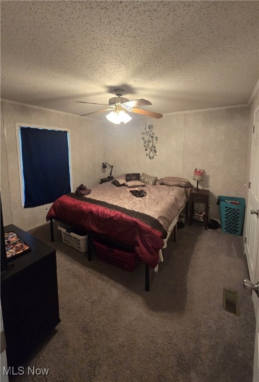 carpeted bedroom with a textured ceiling and ceiling fan