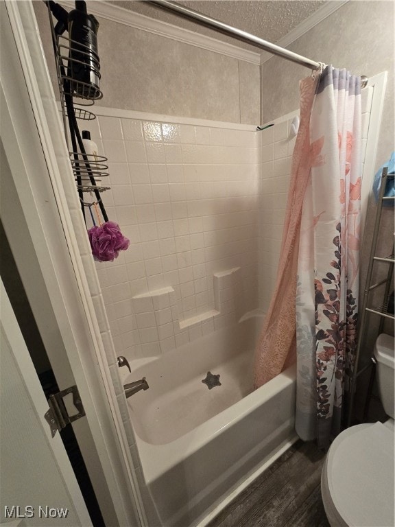 bathroom featuring shower / bath combination with curtain, crown molding, hardwood / wood-style flooring, toilet, and a textured ceiling