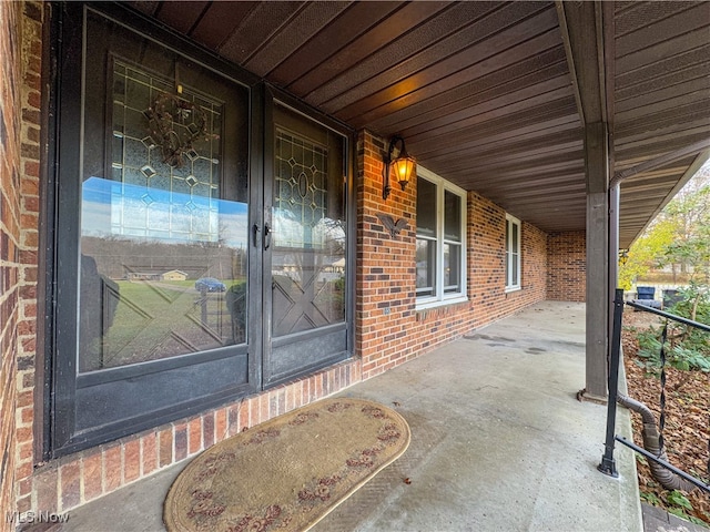 doorway to property with covered porch