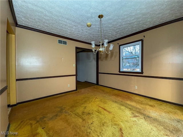 unfurnished dining area featuring a notable chandelier, ornamental molding, a textured ceiling, and carpet floors