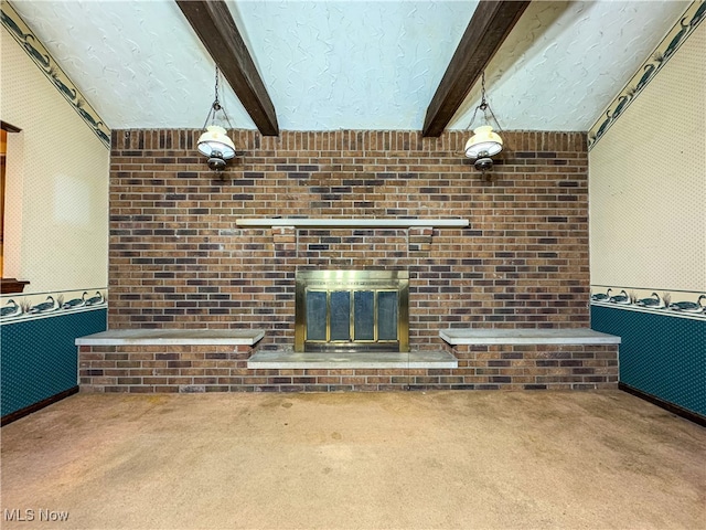 living room featuring beam ceiling, carpet floors, and a fireplace