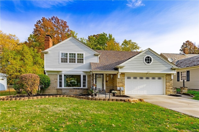 view of front property with a front lawn and a garage