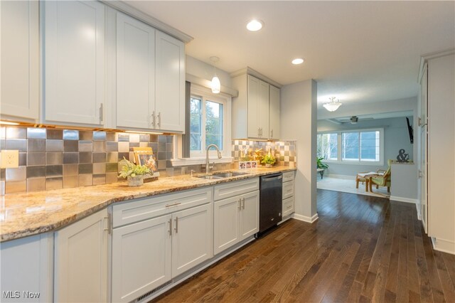 kitchen with dishwasher, sink, tasteful backsplash, dark hardwood / wood-style flooring, and white cabinets