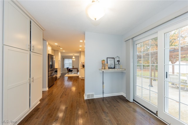 hallway with dark wood-type flooring