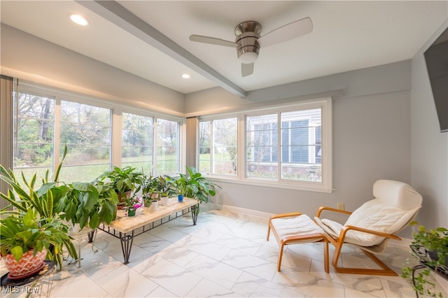 sunroom with ceiling fan