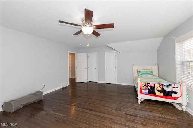 bedroom with ceiling fan and dark wood-type flooring