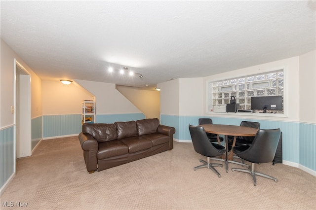 living room with light colored carpet and a textured ceiling