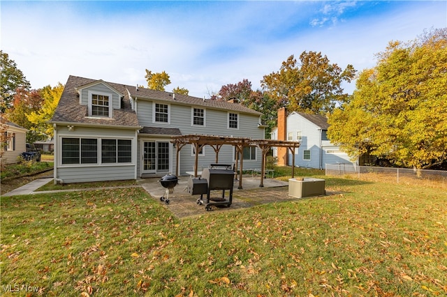 back of property featuring a pergola, a patio, and a lawn