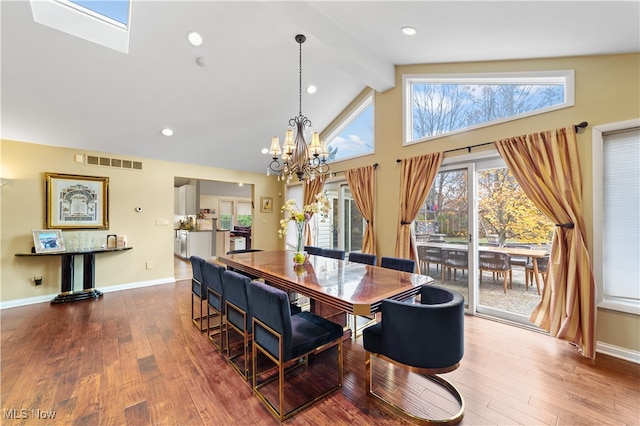 dining room featuring beamed ceiling, hardwood / wood-style floors, high vaulted ceiling, and a notable chandelier