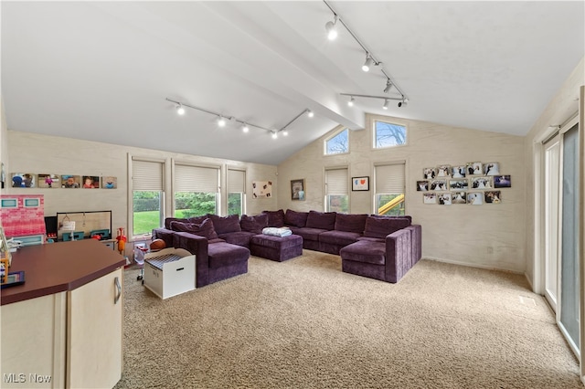 living room with beamed ceiling, light colored carpet, and high vaulted ceiling