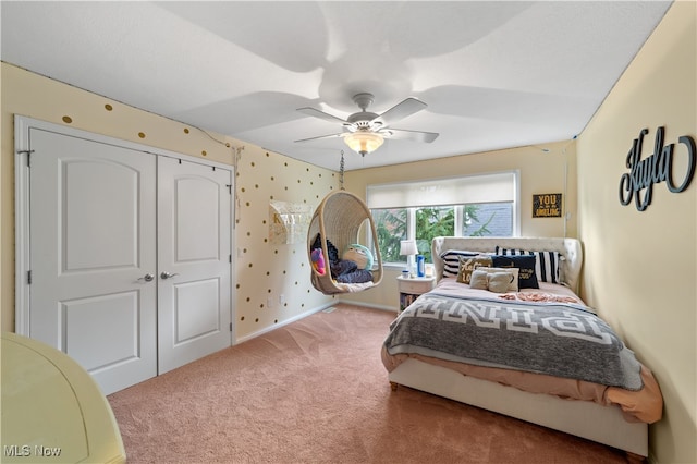 bedroom featuring carpet flooring, a closet, and ceiling fan