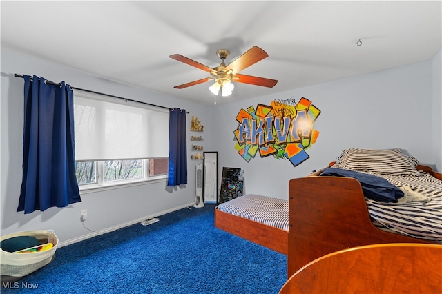 carpeted bedroom with ceiling fan