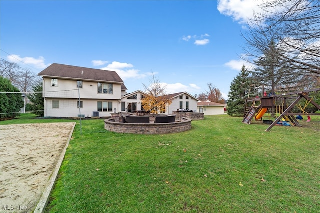 view of yard featuring a playground and central AC