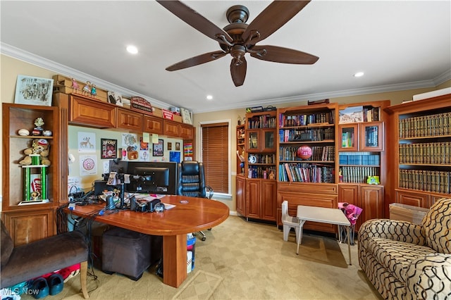 carpeted home office with crown molding and ceiling fan