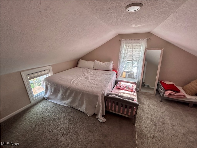 bedroom with dark carpet, lofted ceiling, and a textured ceiling