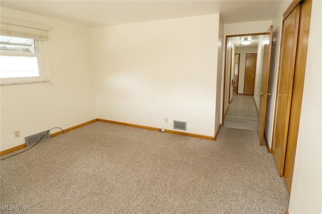 view of carpeted spare room