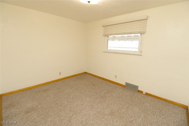 view of carpeted spare room