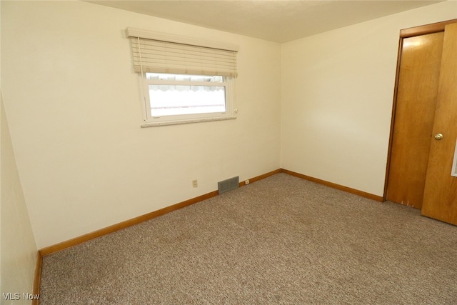 unfurnished room featuring carpet floors