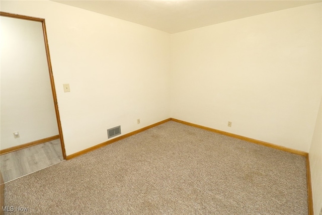 unfurnished room featuring carpet floors