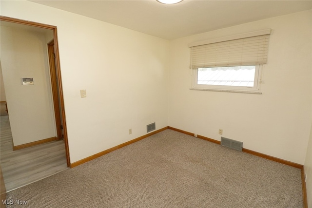 empty room featuring carpet floors