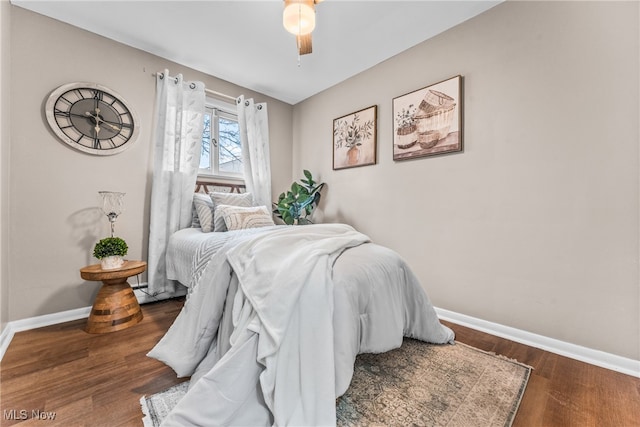 bedroom featuring ceiling fan and dark hardwood / wood-style flooring