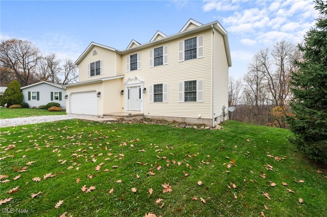 view of front facade featuring a front lawn and a garage