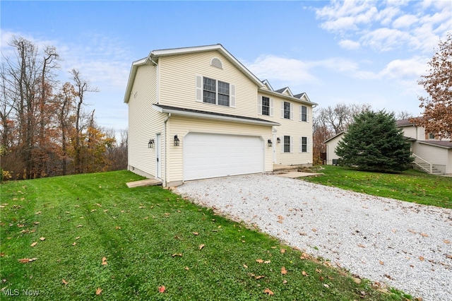 view of front of home featuring a front yard and a garage