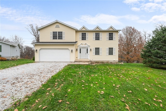 view of front of house with a garage and a front yard