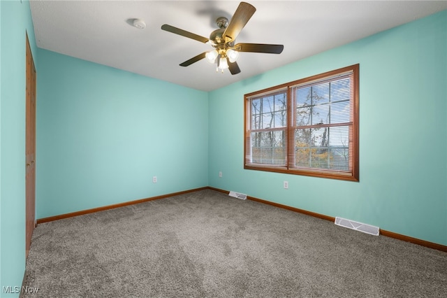 unfurnished room with carpet and ceiling fan