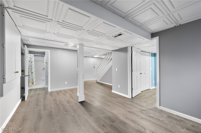 basement featuring light hardwood / wood-style flooring