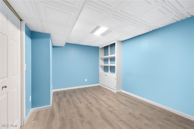 spare room with light hardwood / wood-style flooring