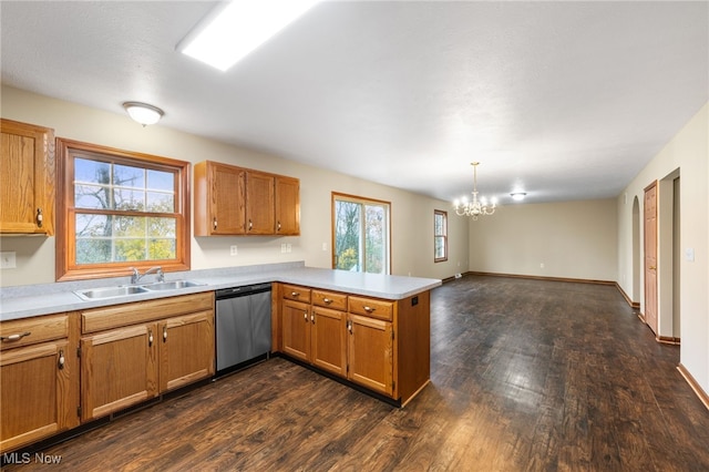 kitchen with dishwasher, plenty of natural light, kitchen peninsula, and sink