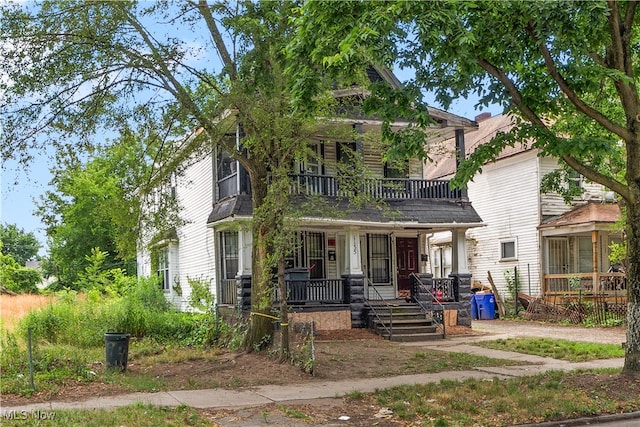 view of front of home featuring a balcony and a porch