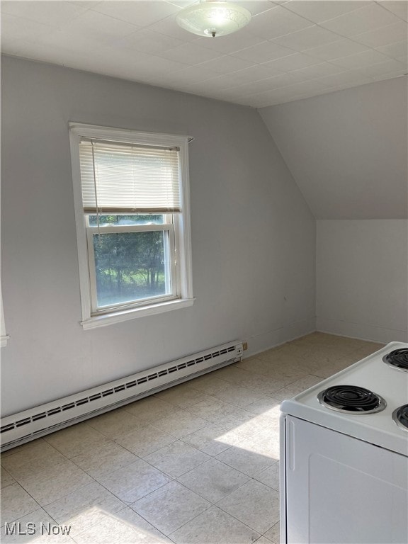 kitchen with lofted ceiling, electric range, light tile patterned floors, baseboard heating, and white cabinetry