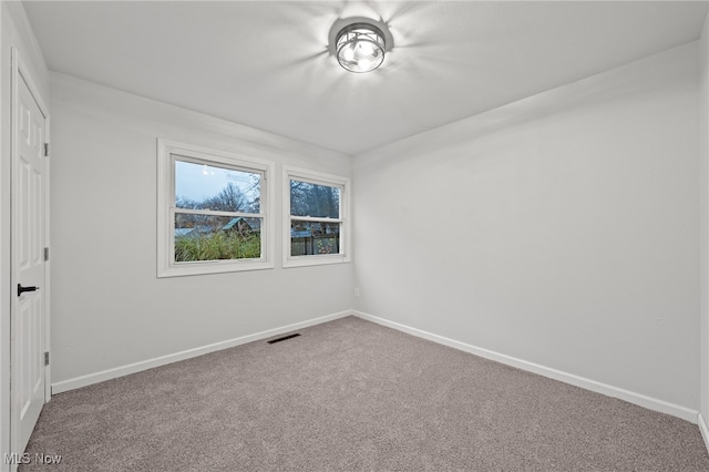 empty room featuring carpet flooring