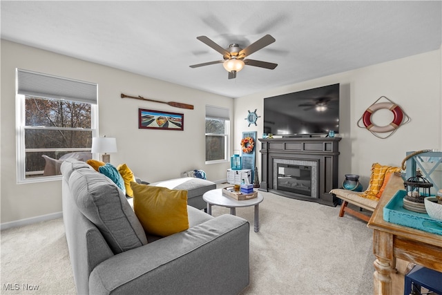 living room featuring light carpet and ceiling fan